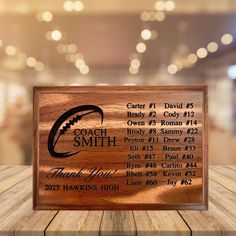 a wooden plaque with the name coach smith on it