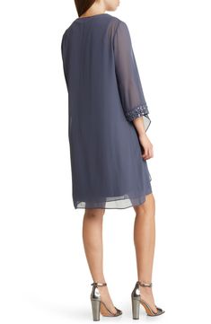 A solid colorway sheath dress with a beaded neckline and a chiffon jacket offers a sophisticated style for any special occasion. 37 1/2" length Dress has crewneck; sleeveless Jacket has three-quarter sleeves Lined 100% polyester Hand wash, dry flat Imported Sequin Short Dress, Chiffon Jacket, Dress With Jacket, Work Dresses For Women, Boat Neck Dress, Ny Fashion, Casual Wedding Dress, Sequin Shorts, Elegant Dresses For Women