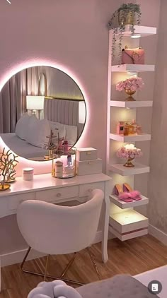 a white desk topped with a mirror next to a chair and shelf filled with flowers