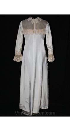 "Lines of ecru daisies create an extravagant, fanciful detail on this classic gown! It has antique inspiration with its close daisy-accent collar, sheer yoke and belled net wrists. The hourglass silhouette is gently fitted with an A-line skirt to the ankle. Detachable train is unadorned satin with a rounded formal hem that extends about four feet behind the bride. Original $90.00 sale tag attached from over forty years ago. New-Old/Deadstock x Ladies' Size 8 to 9 Measurements Bust 35, Waist 29.5 Size 8 Wedding Dress, Classic Gown, Sale Tag, Detachable Train, Hourglass Silhouette, Ivory Bridal, Antique Inspiration, Silk Organza, Hem Dress