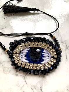 Delicate and unique. Evil eye beaded front and adjustable ties. Hand made. Only one available. Adjustable Bracelet, Evil Eye, Hand Made, Beaded Bracelets, Bracelet, Trending Outfits, Unique Jewelry, Handmade Gifts, Clothes