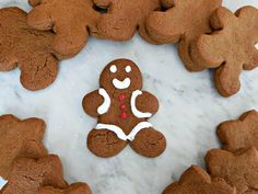 gingerbread cookies with white icing on a marble surface