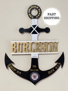 an anchor with the word burleson on it and a rope hanging from it