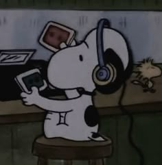 a cartoon dog with headphones sitting on a stool