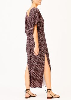 A long geometric printed 100% silk Kaftan dress that features a V neckline, half kimono sleeves, and side slits along the hem. Half Kimono, Silk Kaftan Dress, Silk Kaftan, Geometric Print Dress, Kimono Sleeves, Kaftan Dress, Kimono Sleeve, Beach Day