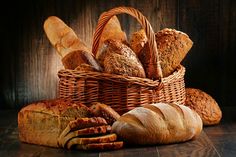 an assortment of breads in a wicker basket