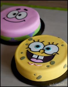 two spongebob cakes sitting on top of a table next to eachother