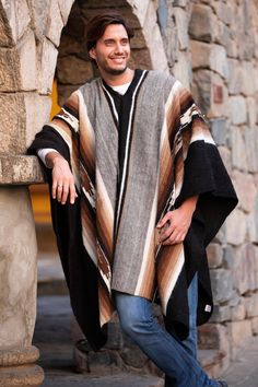 Alpaca wool forms intricate geometric patterns in natural colors. The undyed yarn showcases the soft beige, cream, brown and black tones of this Andean animal. Faustino Maldonado and his family weave a cloak of extraordinary beauty. The piece takes its name from the artisan town of Hualhuas. Artisan Alpaca Poncho For Fall, Men In Ponchos, Mexican Poncho Outfit Men, Handwoven Alpaca Poncho For Fall, One Size Alpaca Poncho, Men’s Poncho, Cozy Brown Wool Poncho, Cozy Brown Alpaca Poncho, Mens Poncho