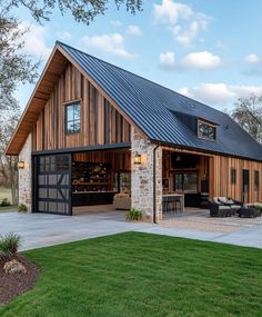 a large barn with an open garage door