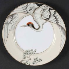 a white and black plate with a bird on it