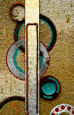 an abstract mosaic design with circles and dots on the wall next to a faucet