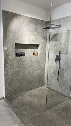 a walk in shower sitting inside of a bathroom