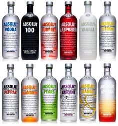 an assortment of absolut vodka bottles with different flavors and colors on the bottles