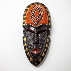 An authentic themed West African tribal masks. These masks are hand carved out of Sese wood and then hand painted by our Ghanaian artisan. It features various paintings and an elongated shapes. Legend has it, African mask are used to scare off Bad Energy. The masks Also signifies Authenticity and Power. * Authentic African Art * Made out of Sese Wood  * Hand Carved * Hand Panted * West African Mask (Ghana) It is used as a home decorative item, or as a wall hanging. This will make a great gift and will stand out in any room. Mask may look bright due to natural light. Kindly note, due to mask being handmade, please expect slight difference in sizes, color and raw material texture. Thank you. CARE; Do not submerge/soak in water. If necessary, use a damp cloth to wipe the mask clean. Made in G Bear Meaning, Animal Characteristics, Traditional Masks, Afrikaanse Kunst, African Sculptures, African Home Decor, African Mask, Africa Art, Masks Art