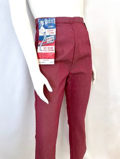 "Vintage Women's 60's NOS, Red, High Waisted, Cropped Pants, Petal Pushers by (M) These Ladies Pants come in a red cotton/nylon blend with a high waist and skinny leg fit, with a side metal zipper and single button closure. The fabric is light with two way stretch and has a slight sheen to the surface. 75% Cotton 25% Nylon Made in USA *These pants are NOS (new old stock) with all original tags attached. There is a snag in the fabric on the booty (photo #9). *If shipped within the US, these pants Retro Stretch Bottoms With Pockets, Vintage Stretch Cotton Bottoms, Vintage Pants With Elastic Waistband, Retro Red Trousers, Vintage High Waist Stretch Pants, Vintage Stretch Full-length Pants, Vintage Stretch High-waisted Pants, Vintage Stretch Full Length Pants, Retro Red High-waisted Pants