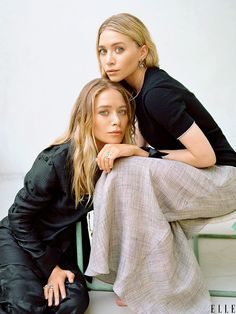 two beautiful women sitting next to each other