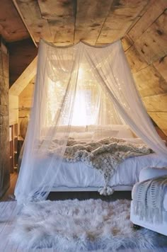 a bed with a white canopy over it