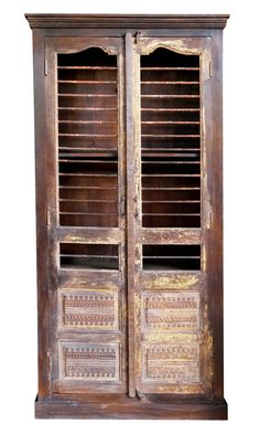 an old wooden cabinet with shutters on the doors