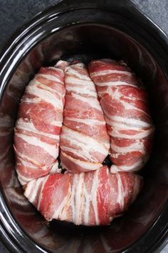 raw meat in a slow cooker ready to be cooked