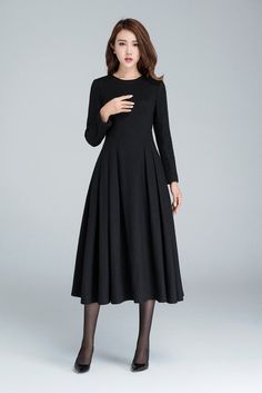 "This Long black dress design with midi length, match a black heel, make you more slim and high. This wool dress design with a smaller collar, so it open by back zipper, so that your head can through easily. This winter dress is warm in cold winter. it has a polyester lining, so don't need worry not comfortable. Details: * Made from black wool * 35% wool blend, 35% fiber and polyester, 30% nylon * Polyester lining * Big Round neckline * No pockets * Back zip closure * Long sleeve * Below the kne Wool Dress Winter, Dress For Winter, Textiles Sketchbook, Clothing Reference, Wedding Dress With Pockets, Dress Winter, Dress Pleated, Winter Dress, Hijab Dress