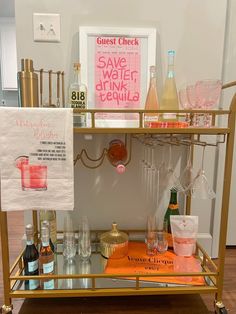 a bar cart filled with bottles and glasses