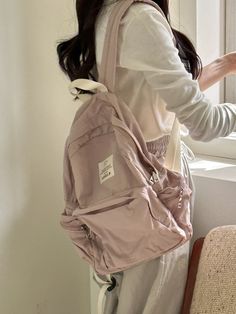 Editor's NoteLENEE.B's bags are good to match for everyday wear.- Feather-like lightness- Light nylon material used- Basic backpack shape- Big zipper pocket for extra storage- Side pocket is good for storing small belongings Measurements (in.)- Size: 12.60 in. * 14.17 in. * 3.94 in. Composition & Care- 100% Polyester- Wipe off moisture and stains with a wet cloth- Bright leather can get stained by denim or dark outfits- The seams generated during the product process and the shaking of fine seam lines are not defects.- Fabric products cannot be washed- Professional leather cleaning is needed- Due to the nature of the color coating, peeling of the color applied to the metal due to natural friction during use is a natural phenomenon.Designer- by LENEE.B Girly Backpacks, Cute Hand Bags, Fabric Products, Aesthetic Backpack, Simple Backpack, Dark Outfits, Cute Backpacks, Pink Backpack, Leather Cleaning