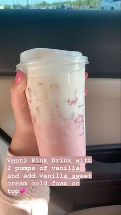 a woman holding up a pink drink in her hand with the caption, venti pink drink