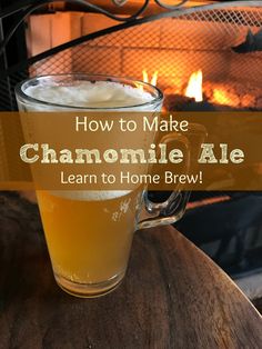 a beer mug sitting on top of a wooden table next to an open fire place