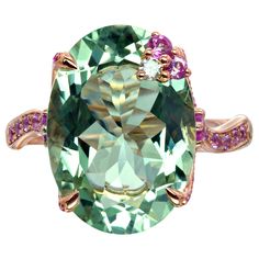 This Bonebakker ring is made in 18 karat rose gold featuring a 15mm x 11 mm oval cut prasiolite, pink sapphires and 0.0.3ct of diamonds. Prasiolite is a green amethyst that radiates energy and balance. This big and colourful stone will sparkle in the sun and reflect the light as you move. The setting holding the wonderful prasiolite is crafted in rose gold and is pave set with sapphires and a diamond. With its delicate, ornamental design and romantic motifs, this filigree ring is a piece of exqu Mens Diamond Jewelry, Ornamental Design, Zipper Jewelry, Jewellery Design Sketches, Green Amethyst Ring, Detailed Jewelry, Filigree Ring, Women Diamond, Green Amethyst