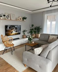 a living room filled with furniture and a flat screen tv