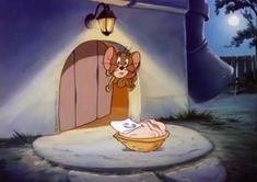 a cartoon character in front of a house with a mouse on it's lap