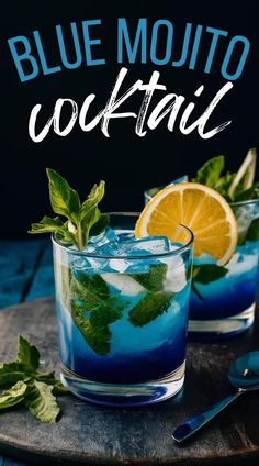 two glasses filled with blue mojito cocktail