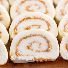 some cinnamon rolls are sitting on a cutting board with the words grandma's potato candy