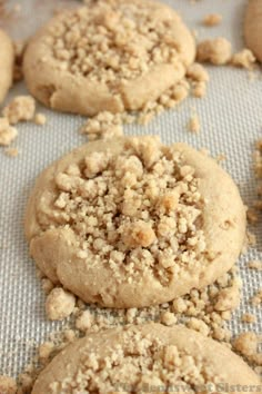 cookies with crumbs are on a baking sheet