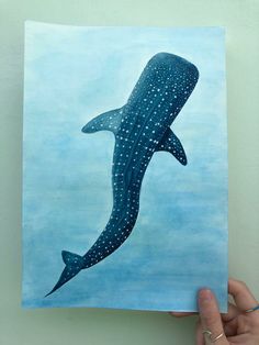 a painting of a whale swimming in the ocean with white dots on it's body