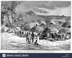 an old black and white photo of people in front of huts