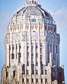 the top of a tall building with many windows