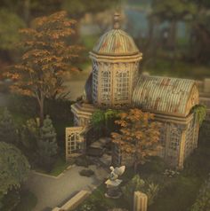 this is an aerial view of a building in the middle of trees and bushes,