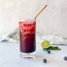 a tall glass filled with blueberry lemonade