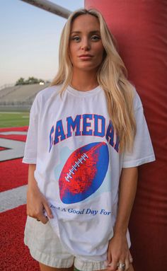 Every day is a good day for a game day! This white tee features a red and blue oversized football and collegiate font. It's perfect for any football fan. 


Haley is 5'6" and is wearing size XL for an oversized look

Phoebe is 5'4" and is wearing size medium


sizing guide: 


fits true to size - size up for an oversized fit

medium measurements: 41" bust and 28.5" length

100% cotton


WE ONLY OFFER STORE CREDIT FOR RETURNS! Feel free to email us at orders@shopriffraff.com or DM us with any que Collegiate Font, Football Graphic Tee, Football Outfits, Gameday Outfit, Comfort Colors Tee, White Tee, Football Fans, Tee Shop, Game Day