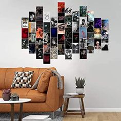 a living room with a couch, table and wall art hanging on the wall above it