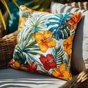 two pillows sitting on top of a wicker chair