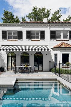 spanish mission style home exterior with swimming pool and striped canopy Yellow Tiles, Tour Photography, Layering Techniques, Built In Banquette, Outdoor Awnings, Homes To Love, Yellow Tile, Outdoor Blinds, Character Home