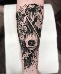 a black and white tattoo on the arm of a person with a wolf head in it