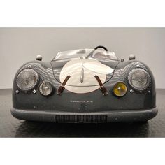 a black and white race car sitting on top of a table