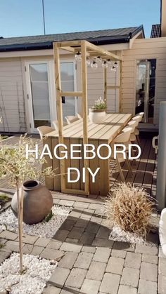 a backyard with a table and chairs in it