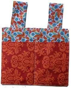 an orange and blue bag with floral designs on it