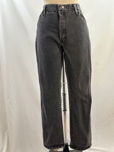 These 80s Rustler jeans will be a closet staple. High waisted, they are a faded black, have a straight leg with a mom fit. Perfect for a fitted turtleneck or a tucked in sweater. -Vintage 90s -Faded black, high waisted -Machine wash recommended  Measurements: *Waist 16 1/2  inches *Hips 20 inches *Inseam 29 inches *Length 39 inches *This item is pre-loved and there may be minor flaws to the garment. Not to worry if there is anything major we will let you know. *worn in look, distressing on zippe Rustler Jeans, High Waisted Jeans Vintage, Faded Black Jeans, Jean Vintage, Jeans High Waisted, Fitted Turtleneck, Jeans Mom, Womens Jeans, Historical Clothing