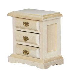 a small wooden table with three drawers on one side and two gold knobs on the other