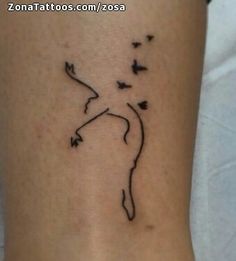 a woman's leg with a small tattoo design on the back of her leg